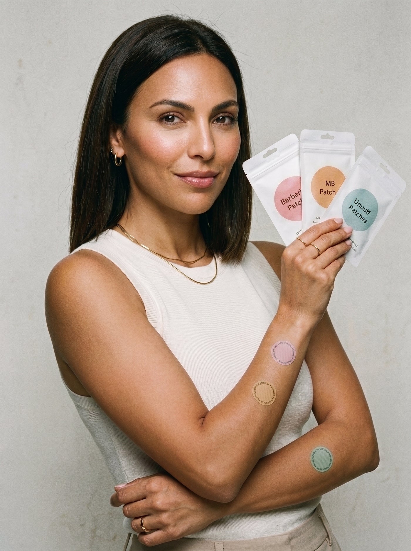 Woman holding Metabolic Trio patches