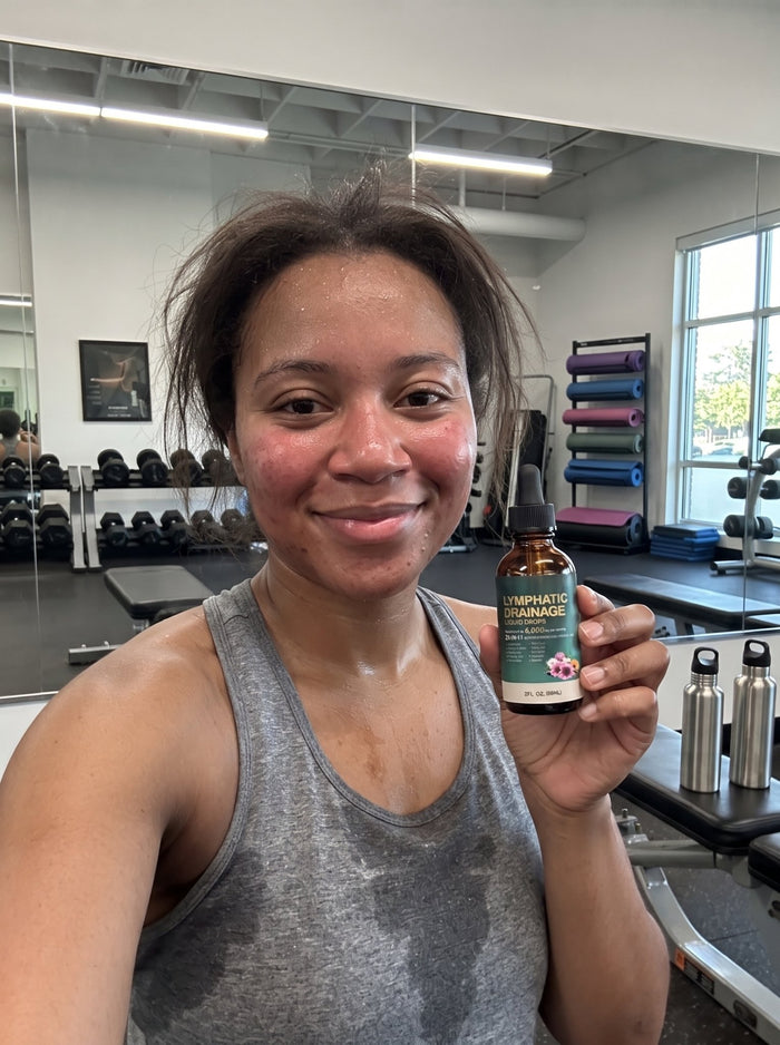 Customer holding Cleantra drops