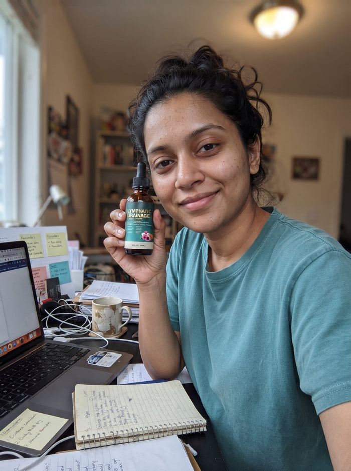 Customer holding Cleantra drops