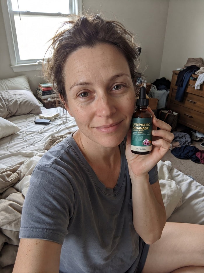 Customer holding Cleantra drops